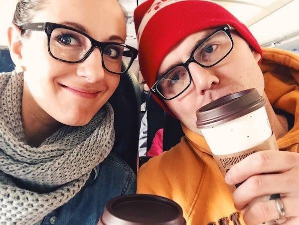 Man and woman on a plane with coffee.