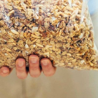 Cabin Granola in a bowl with yogurt and berries.