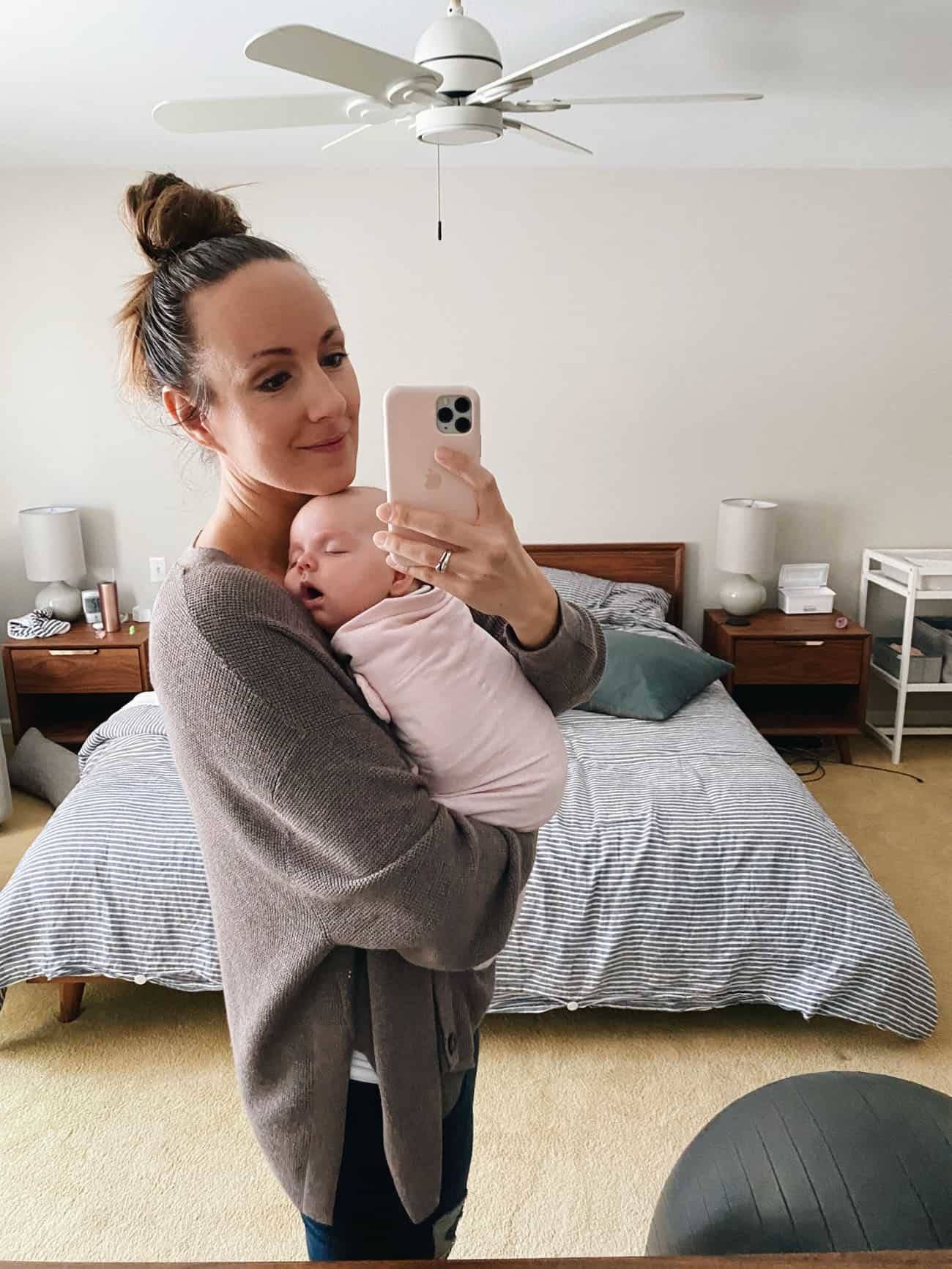 Lindsay holding the sleeping baby.